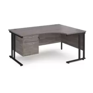 Image of Maestro 25 right hand ergonomic desk 1600mm wide with 2 drawer pedestal - Black cantilever leg frame and grey oak top