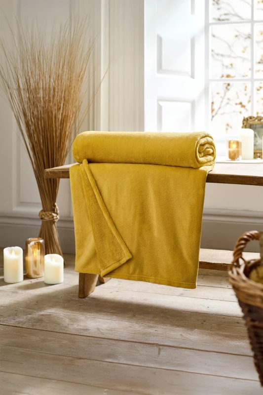 Image of Deyongs Deyongs Snuggle Touch Super Soft Solid Colour Fleece Throw in Yellow Size: 140cm x 180cm Yellow 140cm x 180cm Unisex 5054990142580