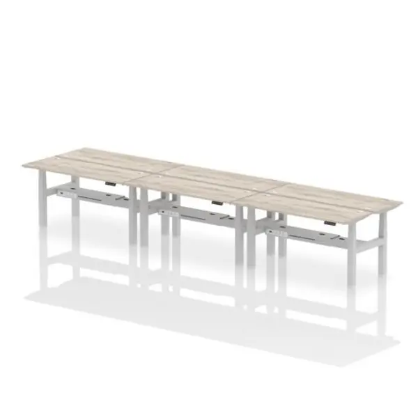 Image of Air Air Back-to-Back 1600 x 600mm Height Adjustable 6 Person Bench Desk Grey Oak Top with Cable Ports Silver Frame HASCP6P16600GRYS