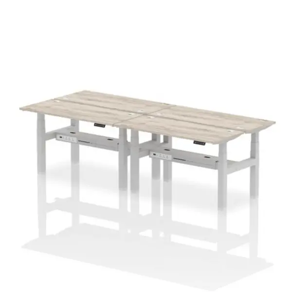 Image of Air Air Back-to-Back 1400 x 600mm Height Adjustable 4 Person Bench Desk Grey Oak Top with Cable Ports Silver Frame HASCP4P14600GRYS