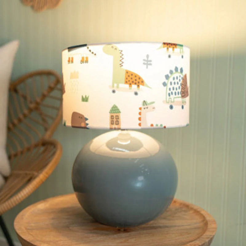 Image of ValueLights Bosco Eucalyptus Teal Globe Ceramic Table Lamp with Cartoon Dino Lamp Shade Multi