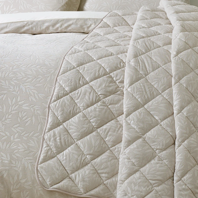 Image of Catherine Lansfield Catherine Lansfield 'Corded Leaves' Quilted Bedspread in Gold Gold One Size Unisex 5057681187570