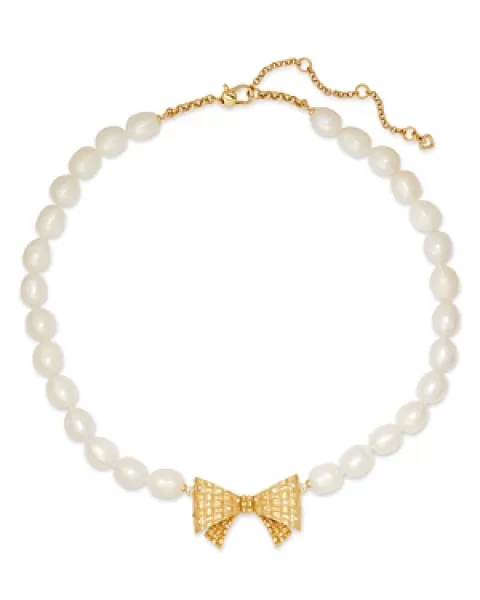 Image of kate spade new york Wrapped In A Bow Pave Bow & Cultured Freshwater Pearl Pendant Necklace in Gold Tone, 17-20