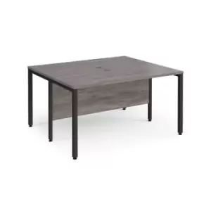 Image of Maestro 25 back to back straight desks 1400mm x 1200mm - Black bench leg frame and grey oak top