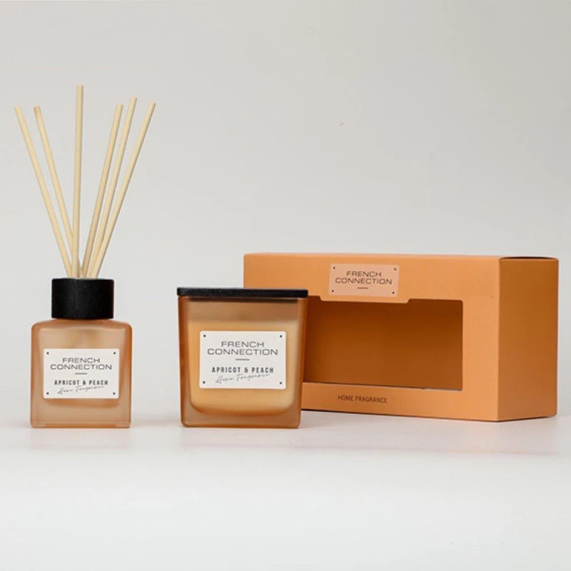 Image of French Connection French Connection Apricot & Peach 200G Candle and 100ml Reed Diffuser Gift Set Square Design in Orange Size: 2 Pack Orange 2 Pack