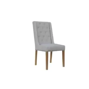 Image of Kettle Interiors Button Back Upholstered Chair With Side Supports And Nailhead Trim Natural