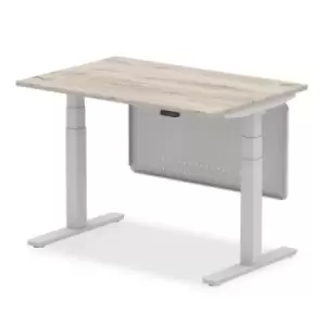 Image of Air 1200 x 800mm Height Adjustable Desk Grey Oak Top Silver Leg With Silver Steel Modesty Panel
