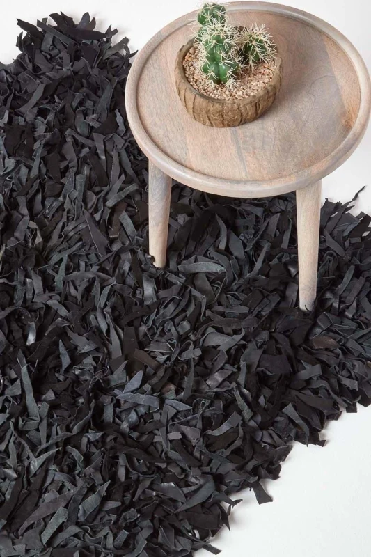 Image of Homescapes Dallas Leather Shaggy Rug Black, 150 X 240 Cm