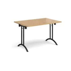 Image of Rectangular folding leg table with Black legs and curved foot rails 1200mm x 800mm - oak