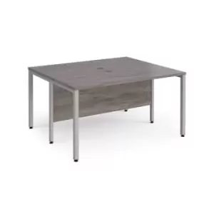 Image of Maestro 25 back to back straight desks 1400mm x 1200mm - silver bench leg frame and grey oak top