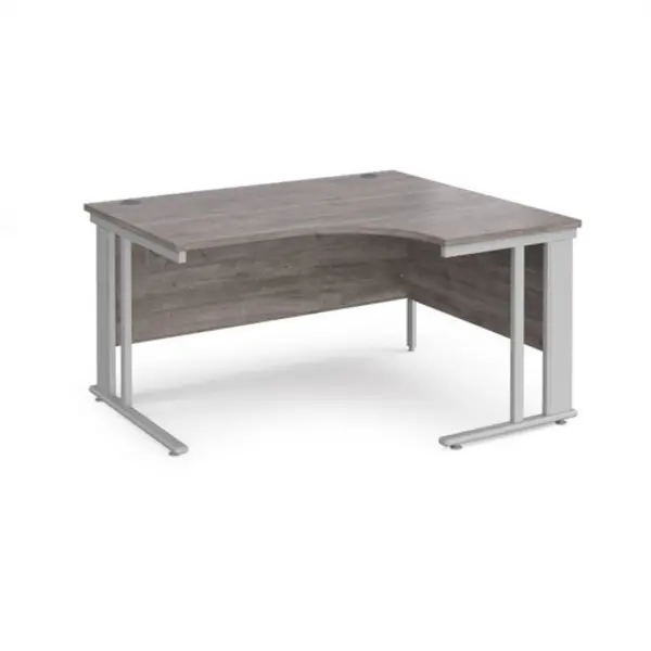 Image of Maestro 25 right hand ergonomic desk 1400mm wide - silver cable managed leg frame, grey oak top