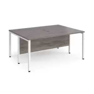 Image of Maestro 25 back to back straight desks 1600mm x 1200mm - white bench leg frame and grey oak top