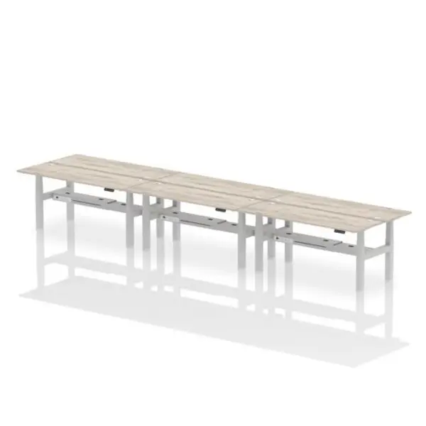 Image of Air Air Back-to-Back 1800 x 600mm Height Adjustable 6 Person Bench Desk Grey Oak Top with Cable Ports Silver Frame HASCP6P18600GRYS